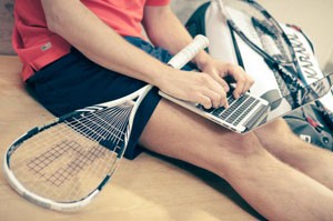 working in shorts with raquet smaller