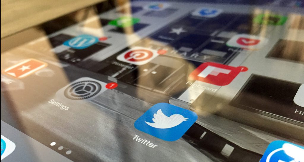 social media icons over keyboard